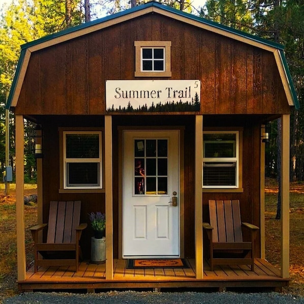 This cozy cabin, nestled among the towering pines and firs, offers a rustic charm and a serene retreat from the hustle and bustle of everyday life. The place features a luxury king-sized bed with cozy blankets, Smart TV, a Keurig Coffee maker, Mini-fridge, a microwave, air conditioning, and heat.