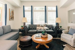 A large living area is a spacious room that can accommodate many people and activities.