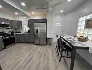 Spacious eat in kitchen stocked with all the essentials