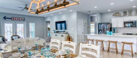 Dining area offers a view of the kitchen and living room.  The space is open, perfect for entertaining and hanging out with family.