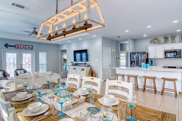 Dining area offers a view of the kitchen and living room.  The space is open, perfect for entertaining and hanging out with family.