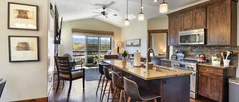 Chefs kitchen with abundant natural light and kitchen island