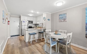 Fully stocked updated kitchen dining room with seats for six people