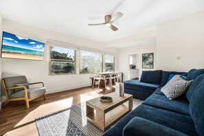 Large living room with dining area off to the right. 