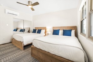 Bedroom 2 is large room with 2 BedGear queen beds. 