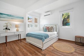 The second bedroom has a full bed, desk and full closet