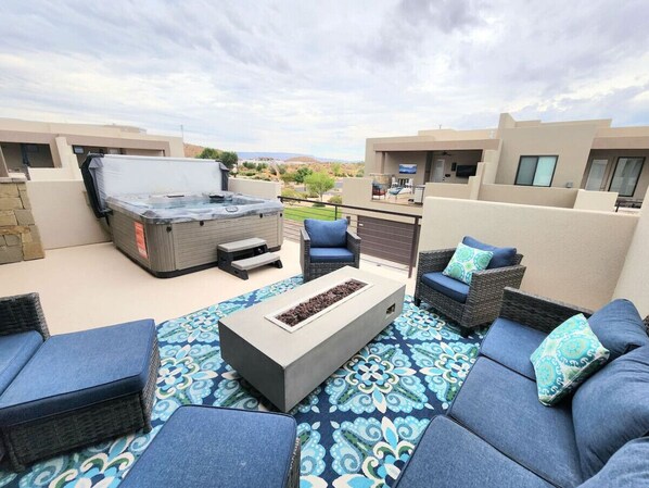 Outdoor seating and hot tub views