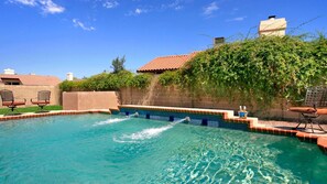 Invigorating swimming pool has both shallow and deeper sections