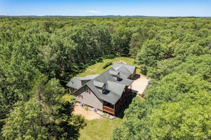 6 acres including trails, firepit, gas and charcoal grills, porch, and deck