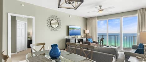 This 3BR/3 BA updated condo features a bright and open living and dining space with tall ceiling, Gulf views, and plenty of seating around a large Smart TV for all your streaming needs.