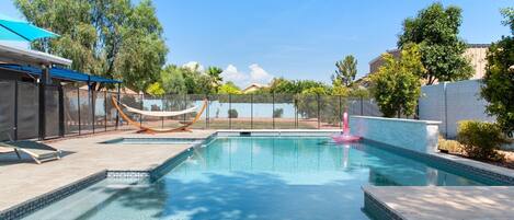 Enormous pool with a large shallow area for the kids or for lounging.