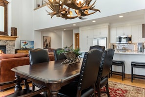 Enjoy Your Dinners Under a Rustic Chandelier at this Beautiful Dining Room Table for 6.