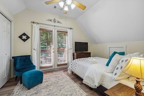 Master Bedroom on second floor with walk out balcony to private wooded area.