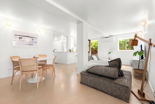 Spacious open plan apartment with courtyard access
