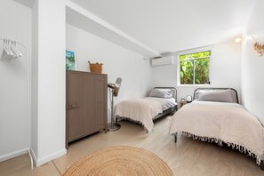 Second bedroom with single beds plus heating/cooling