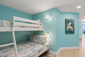 Twin over full bunk bed in hallway.