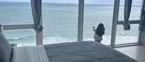 Master bedroom. 2 queen beds with large beachfront/ocean front windows