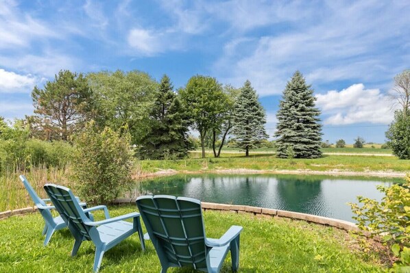 Relax and enjoy the beauty of the serene pond.