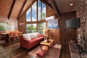 Living Room with A Frame window with stunning views
