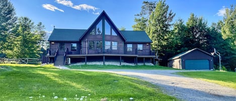 Adirondack Alpine Cabin is a 5-bedroom, 3 full bath luxury vacation rental with hot tub, expansive decking, game room and much more!