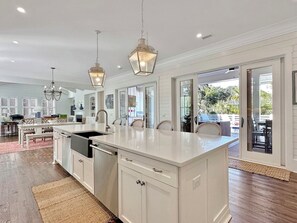 Large Kitchen with walk out to Pool Deck