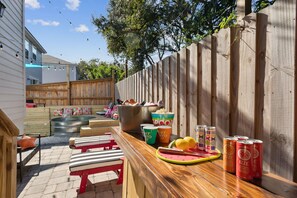 Unwind at your private tiki bar—perfect for tropical drinks & good vibes