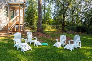 Patio surrounded by lush greeneries. Available for 4 guests