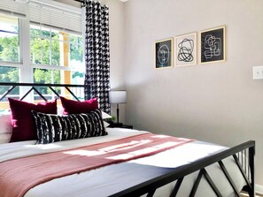 Bedroom with lots of natural lighting flooding in