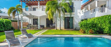 Outdoor heated  Pool with lounge chairs