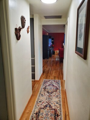 Hallway looking out to the living room from the bedrooms