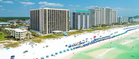 Directly from your unit, step out into a dreamscape: a pristine stretch of beach, with golden sands caressing the ebb and flow of shimmering waves. A panorama of natural beauty awaits you each day, inviting you to indulge in paradise.