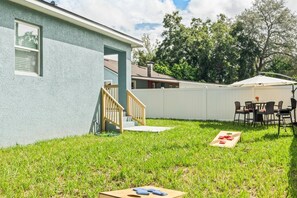 Fully fenced in backyard to bring your pup, enjoy grilling or a game of corn hole!