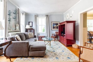 The family room with plenty of seating for the whole family and a flatscreen TV.