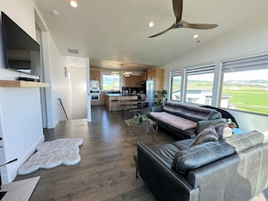 Kick back and relax in the living room, taking advantage of the cozy seating, a wood-burning fireplace and a smart TV.
(Firewood is not provided.)