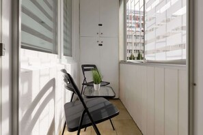 Balcony with garden furniture.