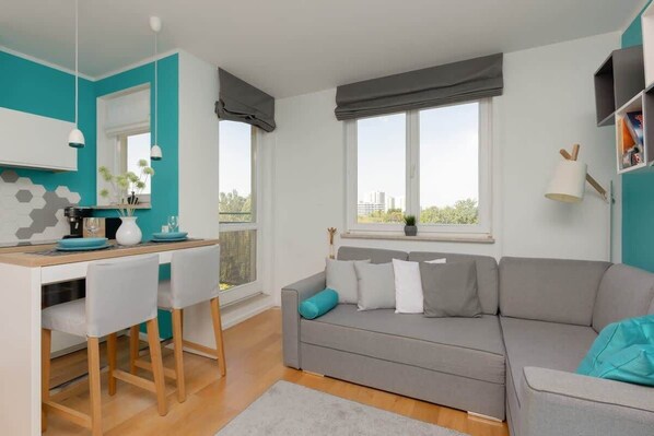 Living room with a comfortable sofa and TV. 
