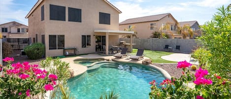 Welcome to paradise!  Beautiful yard with sparkling heated pool!