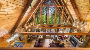 With its soaring ceilings, cozy fireplace, and ample seating, this is the heart of comfort and togetherness.