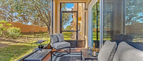 Screened-in porch with seating