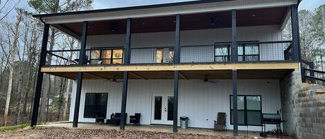 Back of home. Large back deck and porch below.