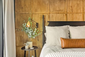An inviting king-sized bed awaits, perfect for resting after a full day.