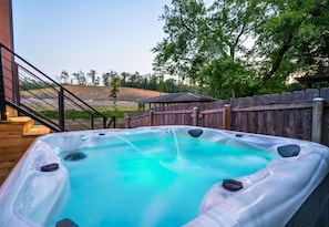 [Outdoor Area] Step into your Stunning Outdoor Area and Relax in the Luxurious Hot Tub.