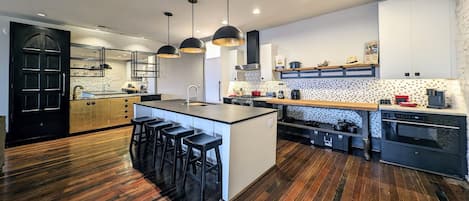 Kitchen, Island eating area and bar.