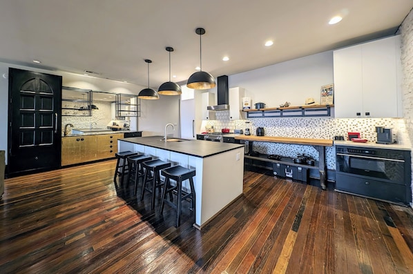 Kitchen, Island eating area and bar.