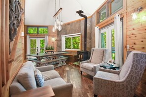 Relaxing family room w/ wood burning stove, smart TV and dinning space 