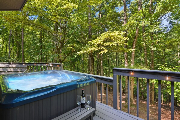 With a hot tub over looking the tranquil forest