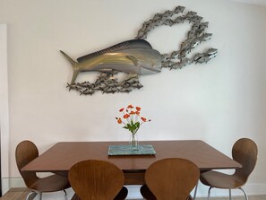 Dining area, open to the kitchen, with glass doors to backyard BBQ and Firepit