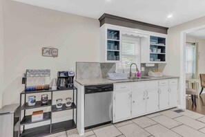 Stainless steel appliances and fully stocked coffee bar