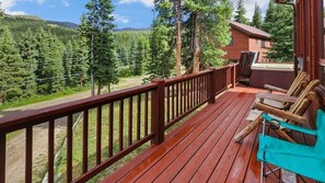 Step out onto the spacious wrap-around deck and enjoy the mountain and tree views.