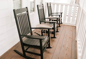 The upstairs porch features rocking chairs for you to enjoy peaceful time outside.